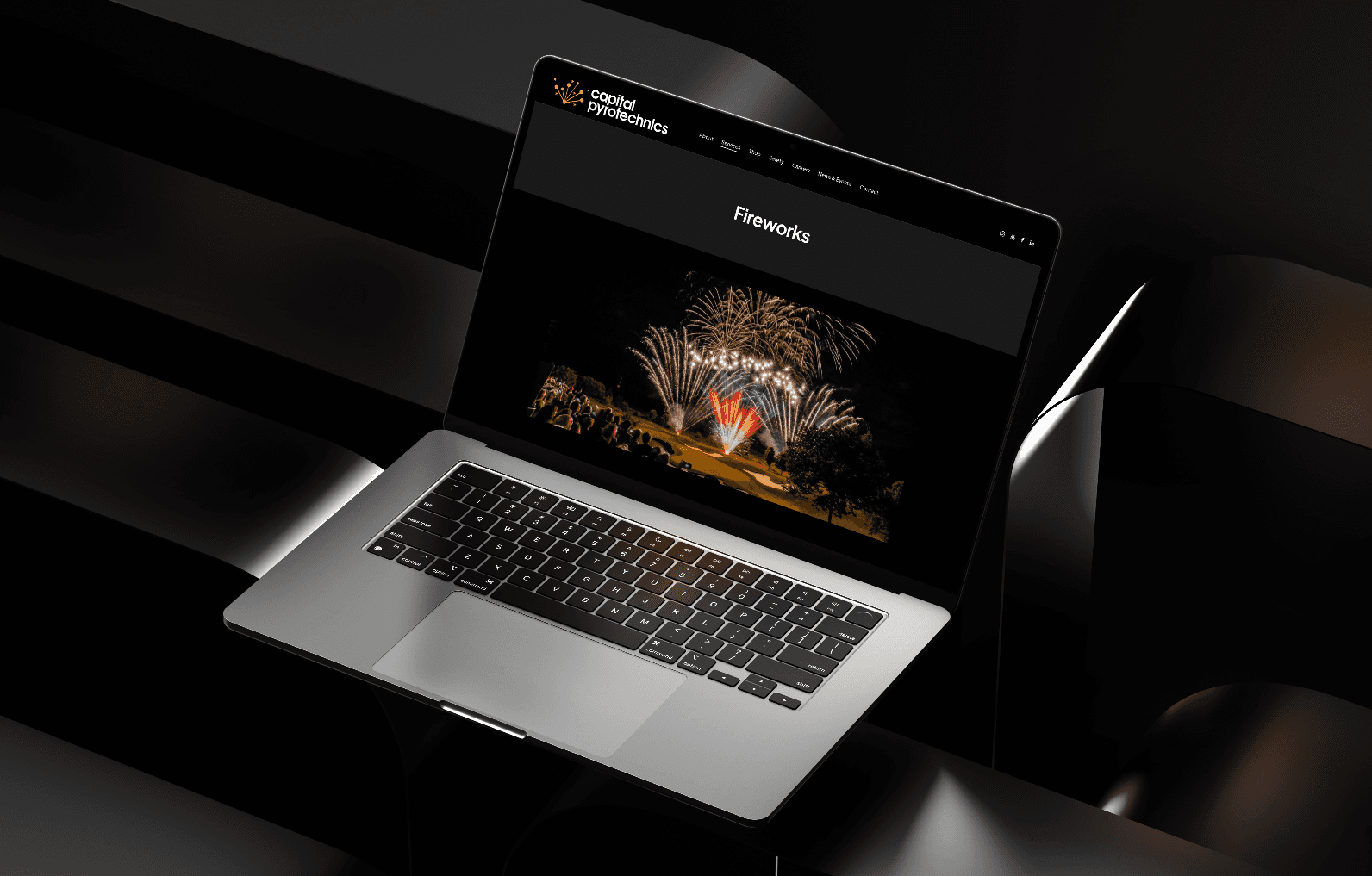 CapitalPyrotechnics.com shown on a laptop